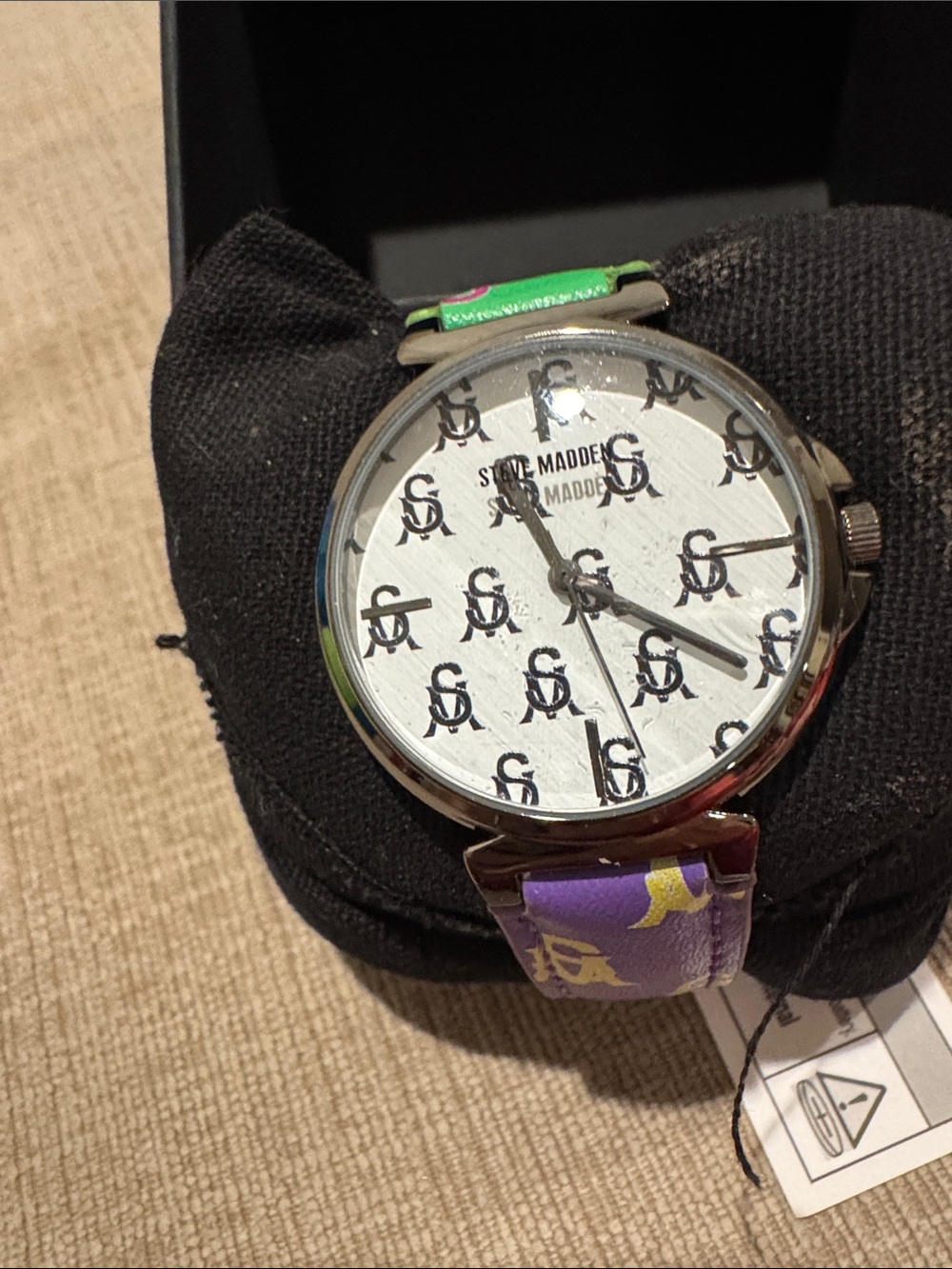 Steve Madden White Logo Dial Watch with Purple and Green Strap need battery